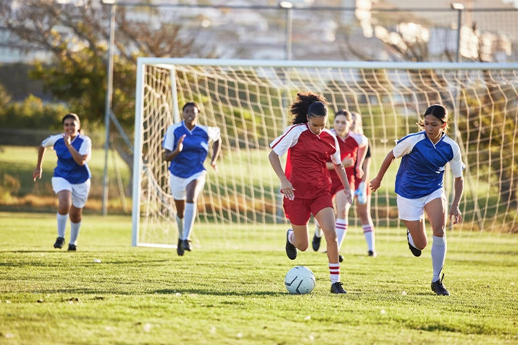 Partido de futbol femenino.