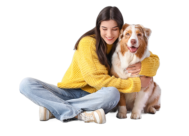 Mujer abraza a su perro sentados en el suelo